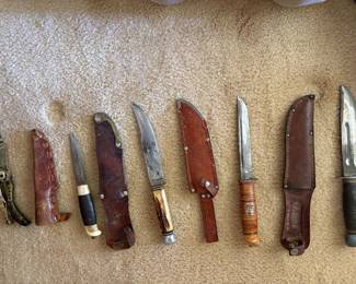 Variety of vintage and antique hunting knives