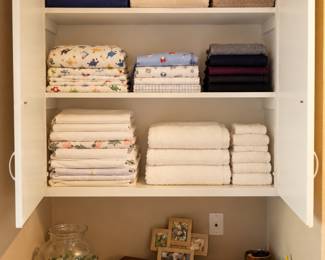 Organized Linen Closet with Cozy Decor