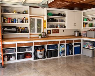Organized Garage Workshop with Workbench and Storage