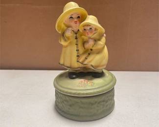 Ceramic Revolving Music Box, Two Children in Yellow Raincoats and Rain Hats