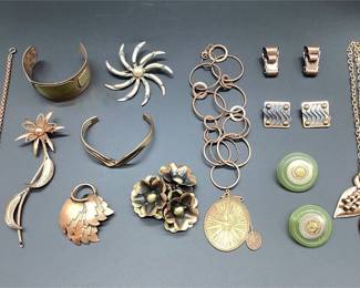 Copper and Copper-Tone Jewelry with Floral Brooches and Bicycle Pendant