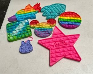 Seven Silicone Push Pop Fidget Toys with L.O.L. Surprise Star, Dinosaur, Rocket