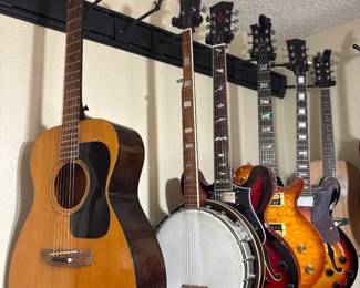 Acoustic Guitar Banjo And Electric Guitars
