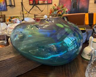 Artistic blown glass shaped around a decorative board
