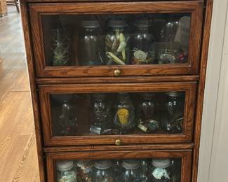 Three-tier wooden barrister (or lawyer) bookcase with Glass front Lift-up doors with oak finish- “The Globe-Wernickle Co”