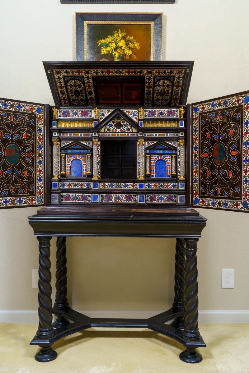LOT 01 – Italian 18th c. Late Baroque Cabinet on Stand ("Milan Tax Chest"). An exceptional late Baroque cabinet-on-stand, the ebony and bone exterior opening to reveal an architectural interior of semi-precious stone inlay, rock crystal columns and gilt bronze ormolu. A cabinet of this ambition was made to display a collector's treasures. Acquired from Dalva Brothers, NYC.