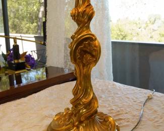 LOT 25 – French 18th c. Louis XV Rococo Candlestick Mounted as Lamp. French 18th c. Louis XV Candlestick mounted as a lamp in brass and ormolu with a spiralling acanthus stem on a shell-cast base, later electrified with a custom shade. Stunning craftsmanship and artistry. From Objets Plus, NYC.