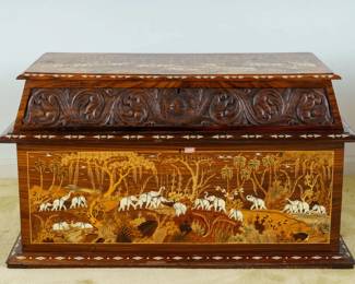 LOT 21 – Indian 20th c. Wood Marquetry and Bone Inlaid Storage Chest. An Indian contemporary large chest with inlaid wood marquetry and bone depicting elephants and tigers in a jungle landscape, with a carved frieze and compartmented, cobalt blue velvet-lined interior. Acquired in Agra, India, in 1995.
