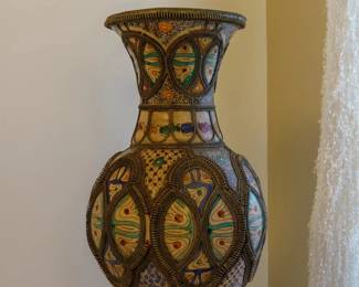 LOT 37 – Late 19c. Jordanian Ceramic Vase. A late 19c. Jordanian, large ceramic vase with polychrome painted panels overlaid with applied metal filigree, on a brass foot. This is a genuinely fascinating piece of material culture where architecture, metalwork, and painting all intersect on one object! Acquired in Amman, Jordan.