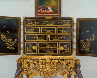 LOT 05 – Japanese 17th c. Lacquer Traveling Chest on Stand. A 17th-century, Japanese lacquered wood traveling chest on an exquisitely carved 19th-century English base, with gold decoration and ornamental brass hinges and hardware. Truly exceptional and stunning craftsmanship on all levels.
