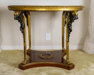 LOT 10 – French c. 1880, Gilt-Bronze Center Table (Charles X style), Verde-marbled Gueridon. A French c.1880, gilt-bronze, verde-marbled, amboyna wood, circular center table (“Gueridon”) in the Charles X manner, with beautifully-crafted winged figurines of the period as supports, and a concave-sided base. Formerly owned by the NYC/Paris interior designer/photographer, Alberto Pinto. Height 31 inches, diameter 38 inches.