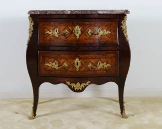 LOT 12 – French 18 c. Commode. A French 18th c. “bombé” Commode with quartered kingwood marquetry, gilt bronze mounts and escutcheons, beneath a shaped brown / maroon background marble top.