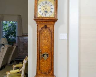 LOT 03 – Dutch Longcase Clock, c. 1738, w/French Marquetry, Otto van Meurs. An Amsterdam longcase clock by Otto van Meurs, dated 1738, with French floral marquetry, an animated harbor scene and moonphase dial. The collection catalog describes two bells, hour and quarter-hour striking, and an alarm. The gilded figures were added in the 19th century, making this a very unique and beautifully crafted piece with every detail.