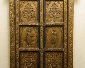 LOT 36 – Indian 20th c. Embossed Brass Ornamental Window Shutters. A pair of Indian ornamental window shutters in intricately-detailed embossed brass over carved wood, the panels worked with royal figures and flowering urns, within a foliate frame. Exquisite craftsmanship & artistry. (~24” H. x 30” W.)