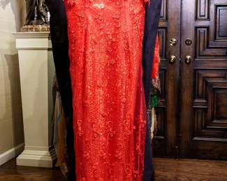 LOT 53 – Breathtaking Bright-Red Lace & Chiffon Evening Gown, With Sequins & Ensemble. A breathtaking bright-red lace and chiffon evening gown featuring a sparkling red sequin underlay that creates a magical “twinkling stars” effect beneath the lace. The gathered back forms an elegant mini-train, accented by a separate inner tier of hand-sewn, swirling lace designs for a truly distinctive and sophisticated look. Designed by famous fashion and costume designer Margi Kent. Sold as a full ensemble set. • Approx. Size ~8 to 8/10; Approx. Measurements: Waist: 30”, Bust: 36, Hips: 36. • Owner’s note: the gowns can be adjusted in size; there is plenty of fabric in the seams.