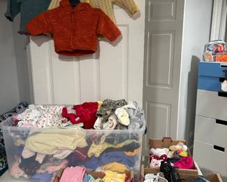 baby clothes, several hand knitted sweaters