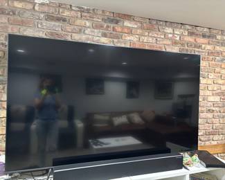 This doesnt look it in this pic, but this is a huge flatscreen tv. I believe it is at least 70" inches