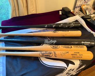 signed bats, signed team bat too.