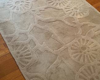 Several mid size rugs throughout home