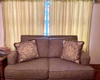 UPHOLSTERED LOVE SEAT WITH PILLOWS