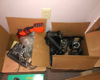 Boxes of vintage telephones