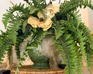 Faux fern and magnolia arrangement in green ceramic planter
