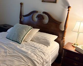 Cherry four poster bed with carved headboard and matching nightstand
