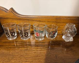 Collection of vintage shot glasses and small glass barware