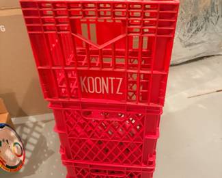 Stack of red plastic Koontz dairy milk crates