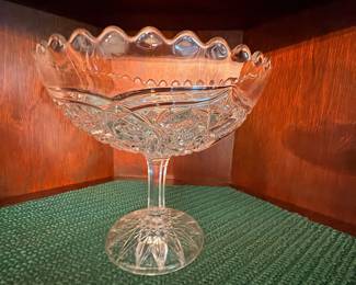 Cut glass pedestal compote with scalloped rim