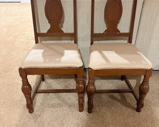 Pair of matching carved wood dining side chairs with upholstered seats