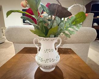 Cream porcelain vase with green clover pattern and faux floral arrangement