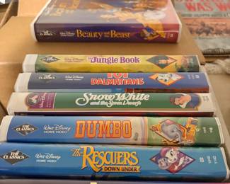 Disney Classics VHS tapes including Beauty and the Beast, Jungle Book, Snow White, Dumbo, and The Rescuers Down Under
