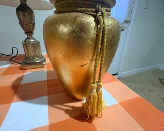 Large gold gilt urn style floor vase with rope tassel accent