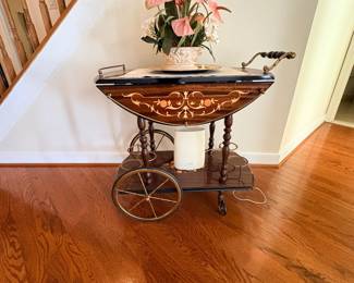 Inlaid wood drop leaf tea cart with spoked wheels and lower shelf