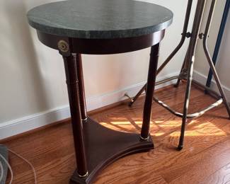 Round green marble top accent table with brass trim