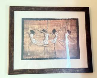 Framed contemporary art print depicting four dancing female figures in white dresses against a textured gold and bronze background.