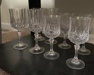 Set of vintage crystal wine goblets featuring a diamond-cut pattern on the lower bowl and a faceted stem.