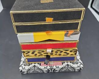 Seven 7 Sets of Boxed Playing Cards Displaying Assorted Themes and Patterns
