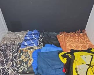 Large Collection of Fashion Scarves, Wraps, and Shawls in a Variety of Fabrics, Colors, and Patterns