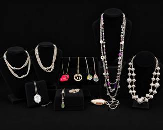 Necklace Collection with Layered Chains, Textured Beads  Decorative Pendants
