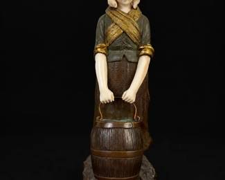 Etling Paris Woman Holding Bucket Stautue with Green Jacket and GoldColored Accents