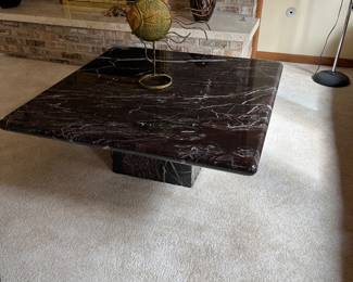 Marble cocktail table black with purple hues