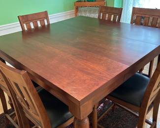 Handsome high top dining room table with 8 chairs.  