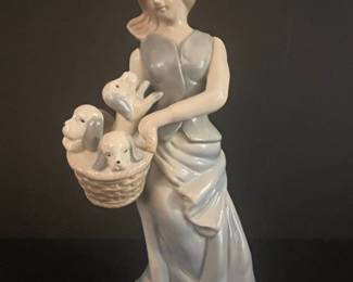 Porcelain Figurine of Woman with Puppies