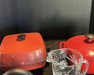 Lot 51: Red Cast Iron Cookware, Stainless Steel Kettle, and Glass Pitcher