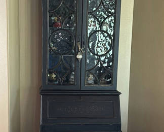 Lot 102: Black Display Cabinet and Decorative Metal Pitchers