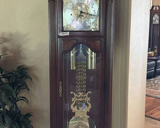 Lot 100: Wooden Grandfather Clock and Potted Artificial Plant