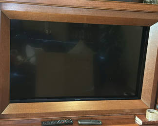 Lot 115: Sony Flat Screen Television with Entertainment Cabinet and Onkyo Receiver