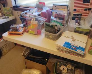 Notebooks, bags of ribbon, etc